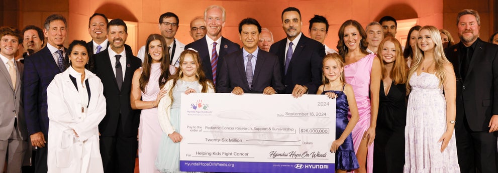 helping kids fight cancer foundation showing their big check from hyundai hope on wheels - Dave Hallman Hyundai in Erie PA