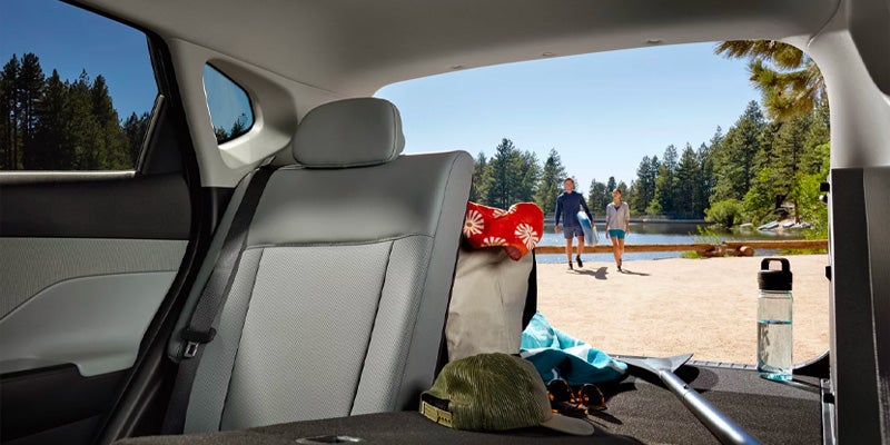 View of the rear passenger seats and open trunk space.