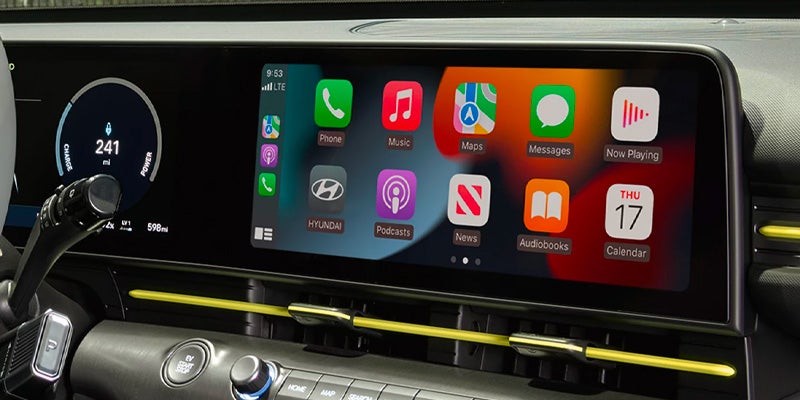 Close-up of a car touchscreen displaying a colorful app menu.