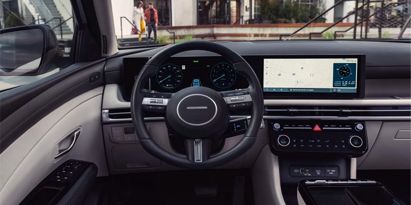 Modern car interior featuring a digital dashboard and wide infotainment screen.